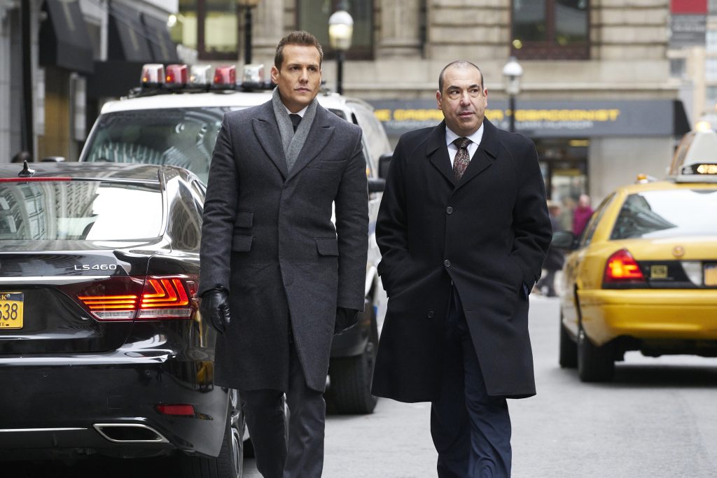 Suits Season 7 - The Tiny Violin Episode with Gabriel Macht as Harvey Specter and Rick Hoffman as Lewis Litt.