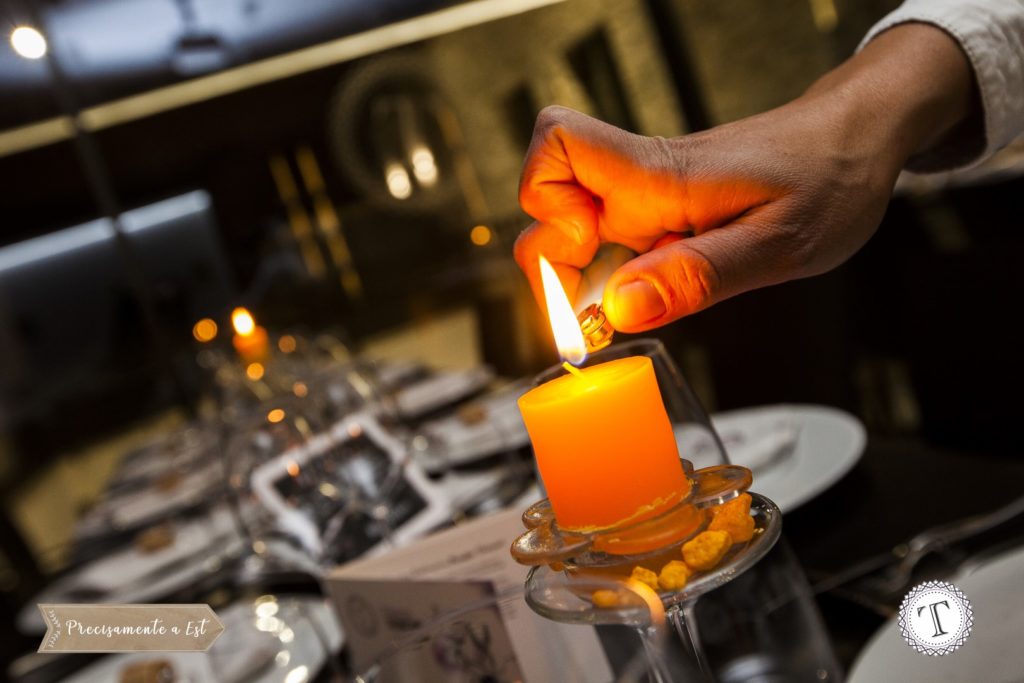 A candle is lit at dinner time at Palazzo Tronconi.