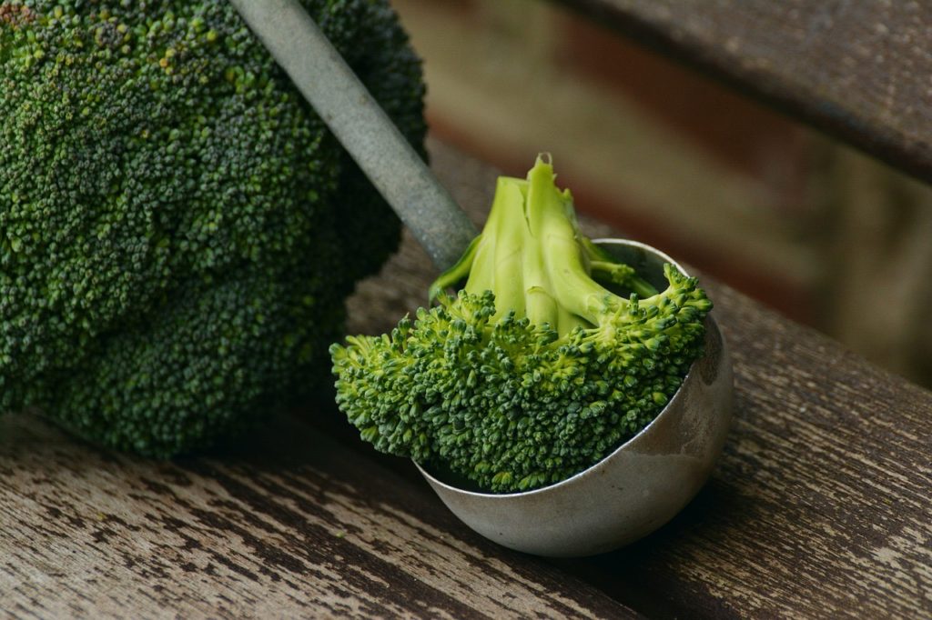 Organic broccoli in a ladle