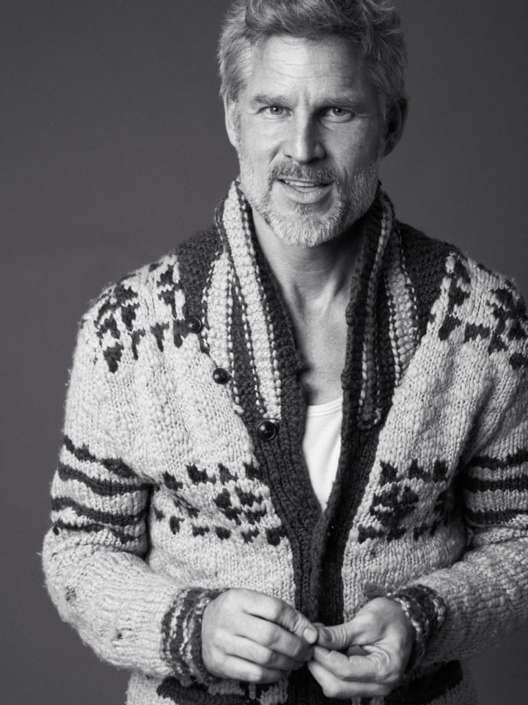 Actor and Model Noah Huntley wearing a handmade artisan cardigan.