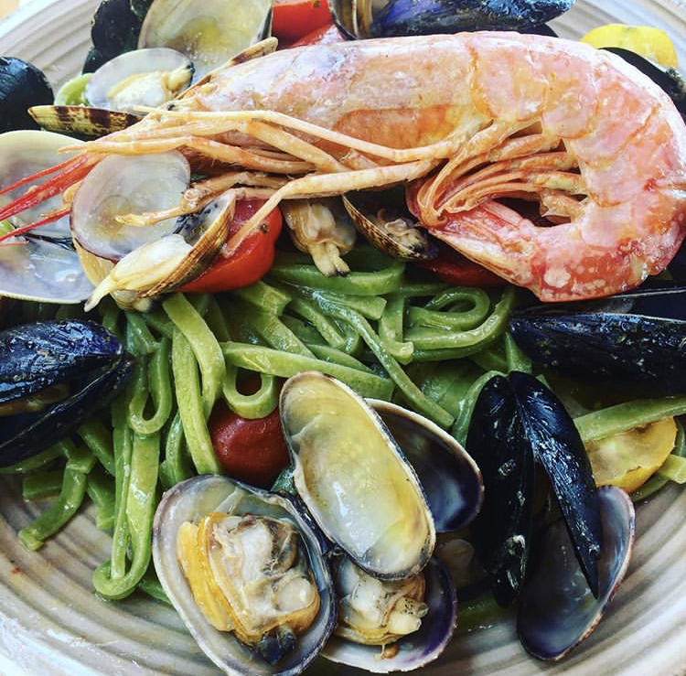 Local seafood with pasta in Sperlonga, Italy.