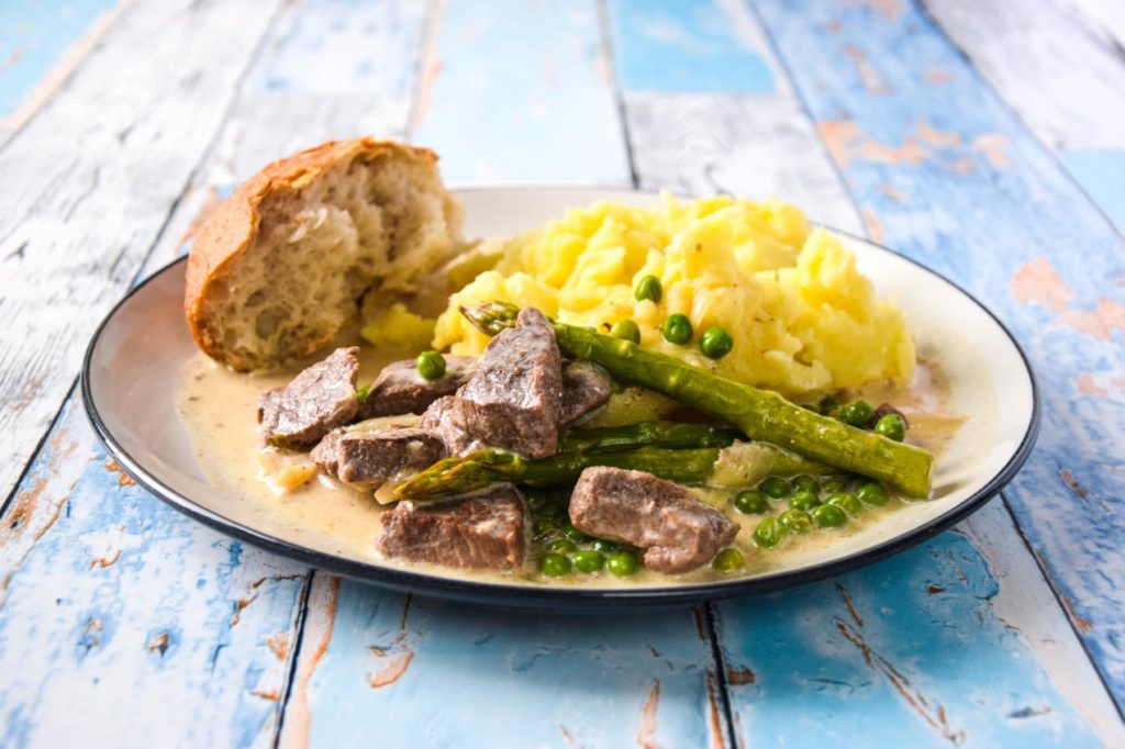 Wild boar cooked in cider with mashed potatoes and crusty bread.