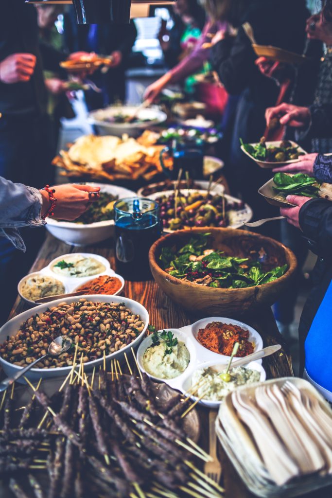 Traditional organic Greek food served family style. Photo by Kaboompics.com from Pexels.